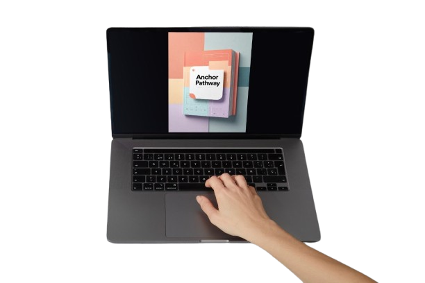 A gray laptop on a white background with a hand resting on the trackpad. The screen displays a colorful graphic with the text 'Anchor Pathway'.